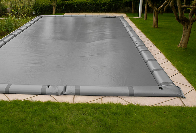 Copertura Invernale per piscina WINCOVER GRIGIA 260 gr/mÂ² con occhielli e porta salsicciotti
